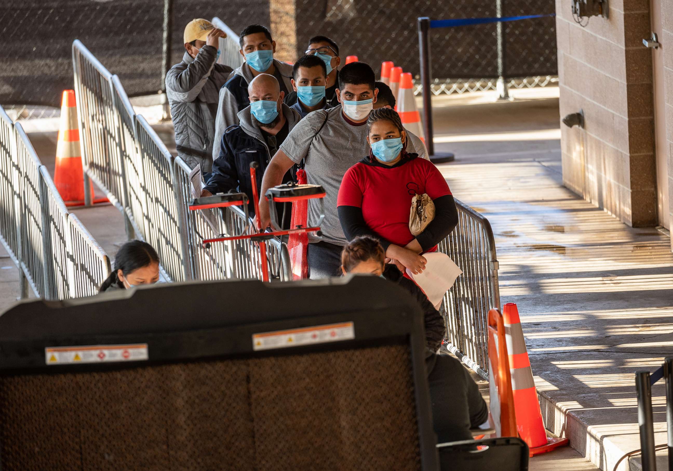 PHOTO: In this Dec. 2, 2022, file photo, immigrants register with authorities after being permitted to seek political asylum in Brownsville, Texas.