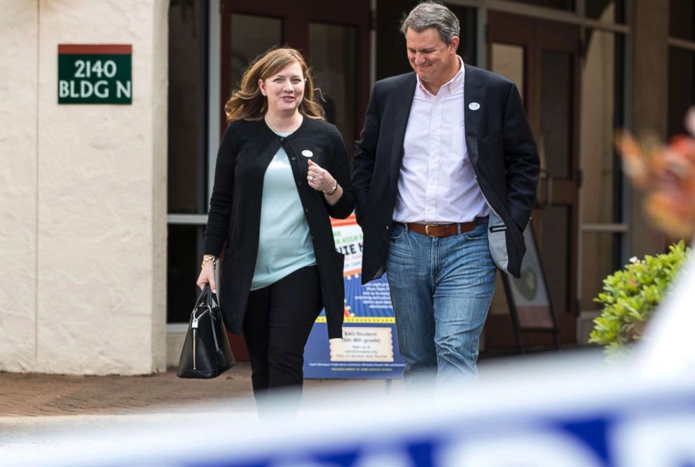 PHOTO: Lizzie Pannill Fletcher, a Democrat running for the 7th Congressional District seat in the U.S. House of Representatives, and her husband, Scott Fletcher, after voting in the primary election in Houston, March 6, 2018.