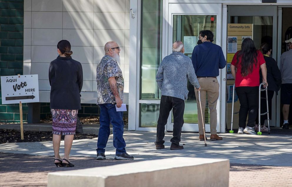 PHOTO: Voters wait in line to cast their ballots in the Texas 2022 primary election in San Antonio, Texas, March 1, 2022.