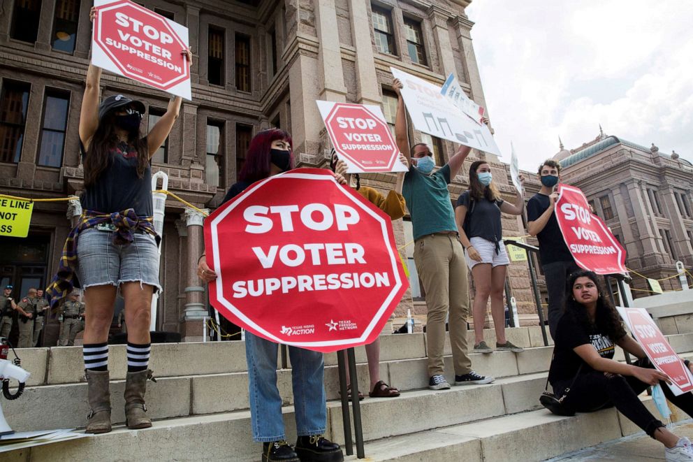 PHOTO: Voting rights activists gather during a protest against Texas legislators who are advancing new voting restrictions in Austin, Texas, May 8, 2021. 