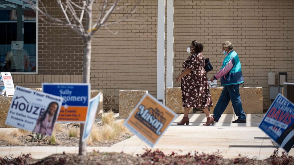 PHOTO: Voters walk into the Oak Cliff Government Center to participate in the primary election in Dallas, Texas, March 1, 2022.