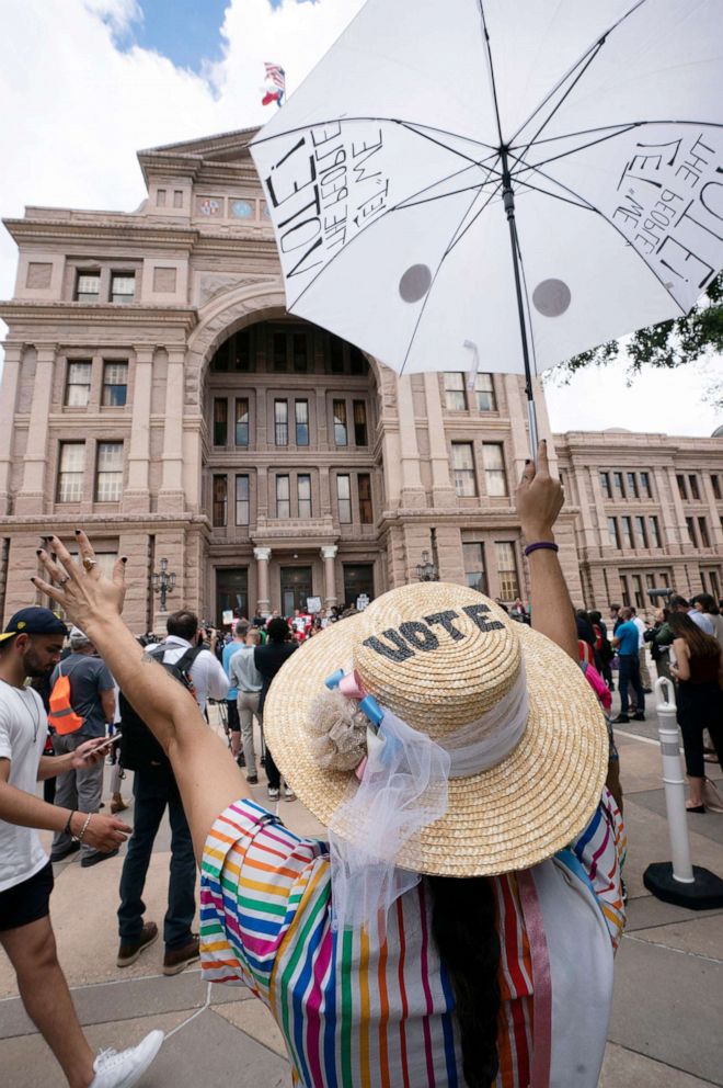 PHOTO: Jessica Ramirez of Austin shows her support as a coalition of voting rights during a rally at the Capitol to decry voter suppression bills being advocated by Gov. Greg Abbott in Austin, Texas, July 8, 2021.