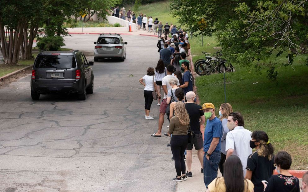PHOTO: Texas residents line up in record numbers for early voting, April 27, 2021, in Austin, Texas.