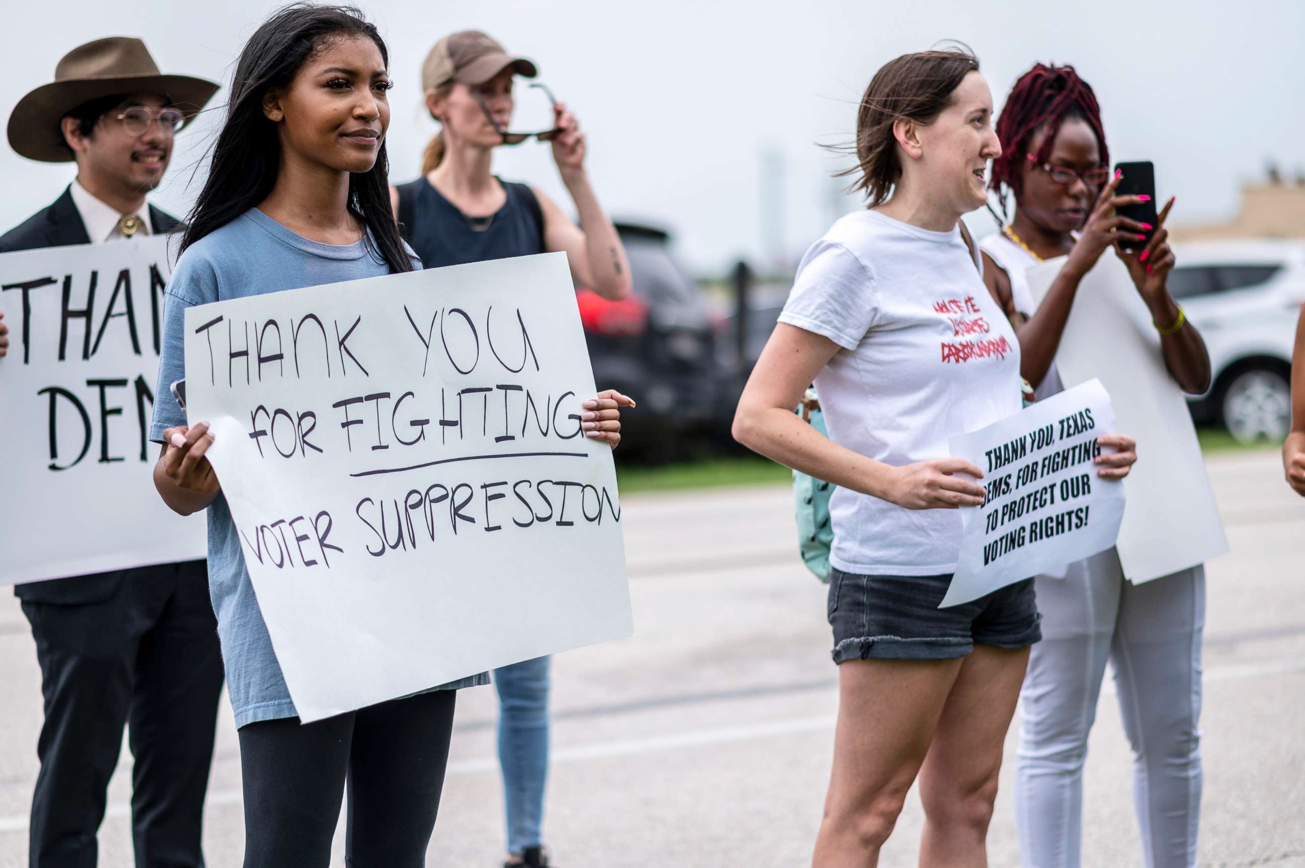 PHOTO: Supporters for Texas Democrats stand outside the Austin Bergstrom International Airport on July 12, 2021, in Austin, Texas.