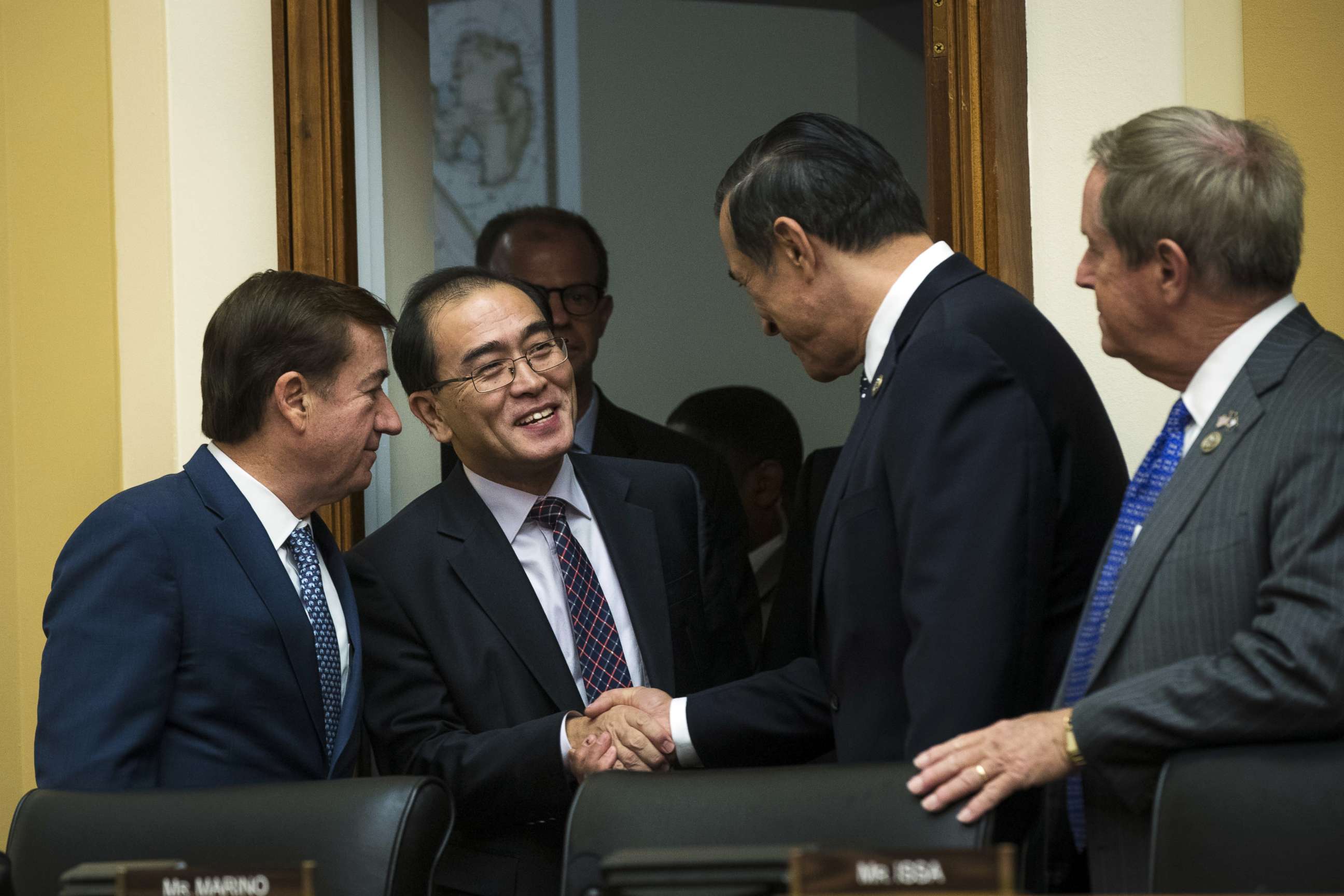 PHOTO: Thae Yong-ho, former chief of mission at the North Korean embassy in the United Kingdom, is greeted by members of congress at the start of a House Foreign Affairs Committee hearing on Capitol Hill, Nov. 1, 2017 in Washington.