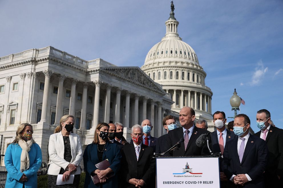 PHOTO: Rep. Tom Reed and Rep. Josh Gottheimer, co-chairs of the bipartisan Problem Solvers Caucus, hold a news conference with fellow members of Congress outside the Capitol, Dec. 03, 2020.