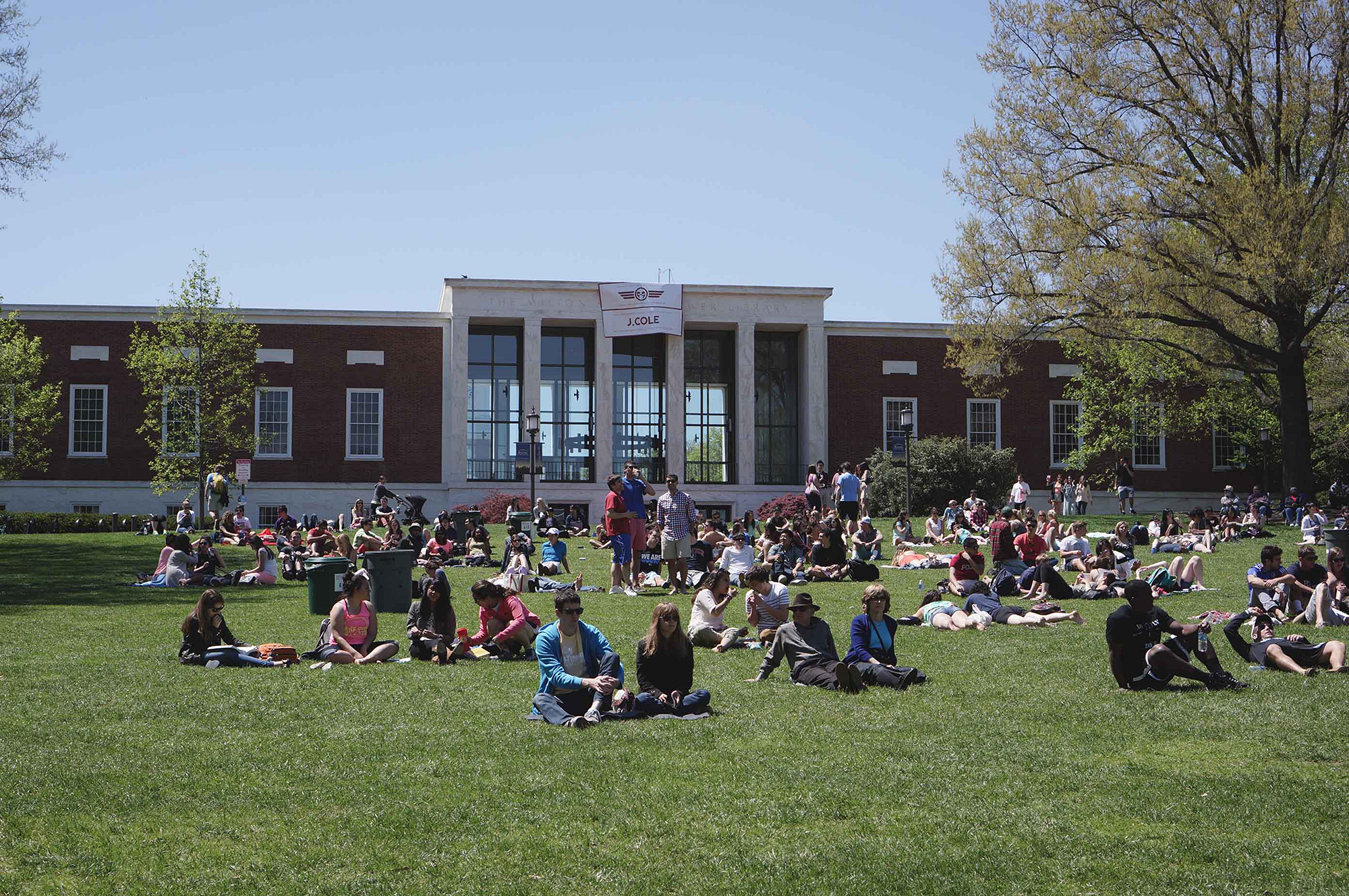 PHOTO: College students and members of the Johns Hopkins and Baltimore communities sit on the beach in Baltimore, 2014.