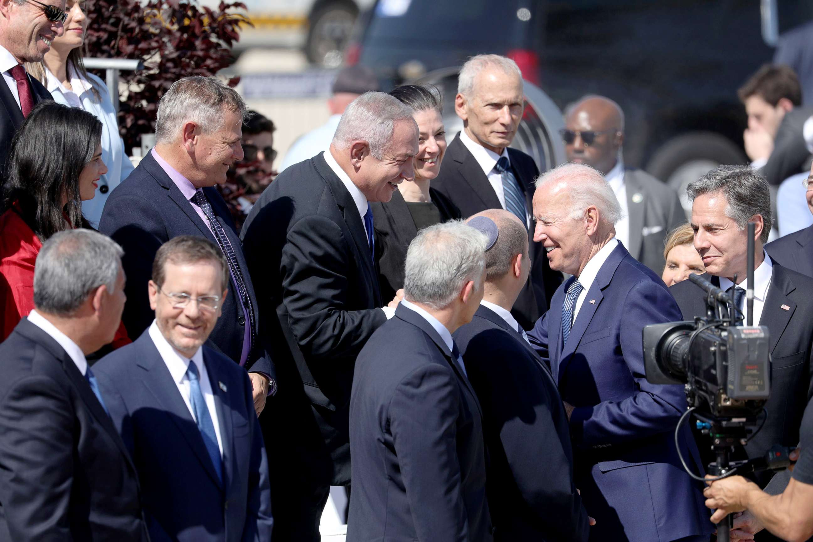 PHOTO: US President Joe Biden shares t moment with Israeli former prime minister Benjamin Netanyahu upon arrival at Ben Gurion Airport, in Lod, Israel, July 13, 2022. 