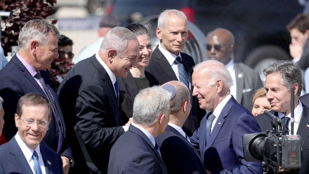 PHOTO: US President Joe Biden shares t moment with Israeli former prime minister Benjamin Netanyahu upon arrival at Ben Gurion Airport, in Lod, Israel, July 13, 2022. 
