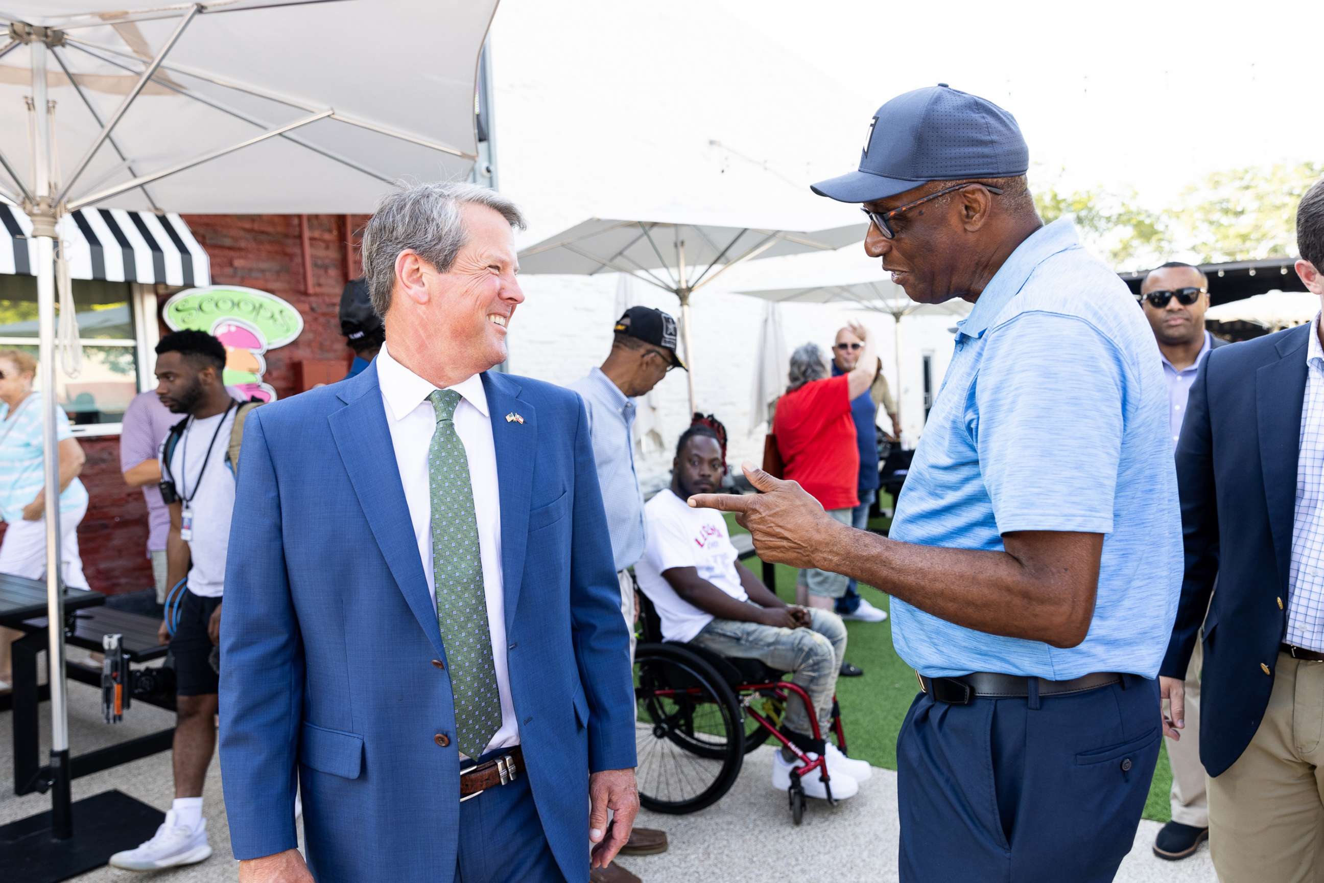 PHOTO: Brian Kemp, governor of Georgia, left, speaks with a constituent after a news conference in McDonough, Ga., July 29, 2020. 