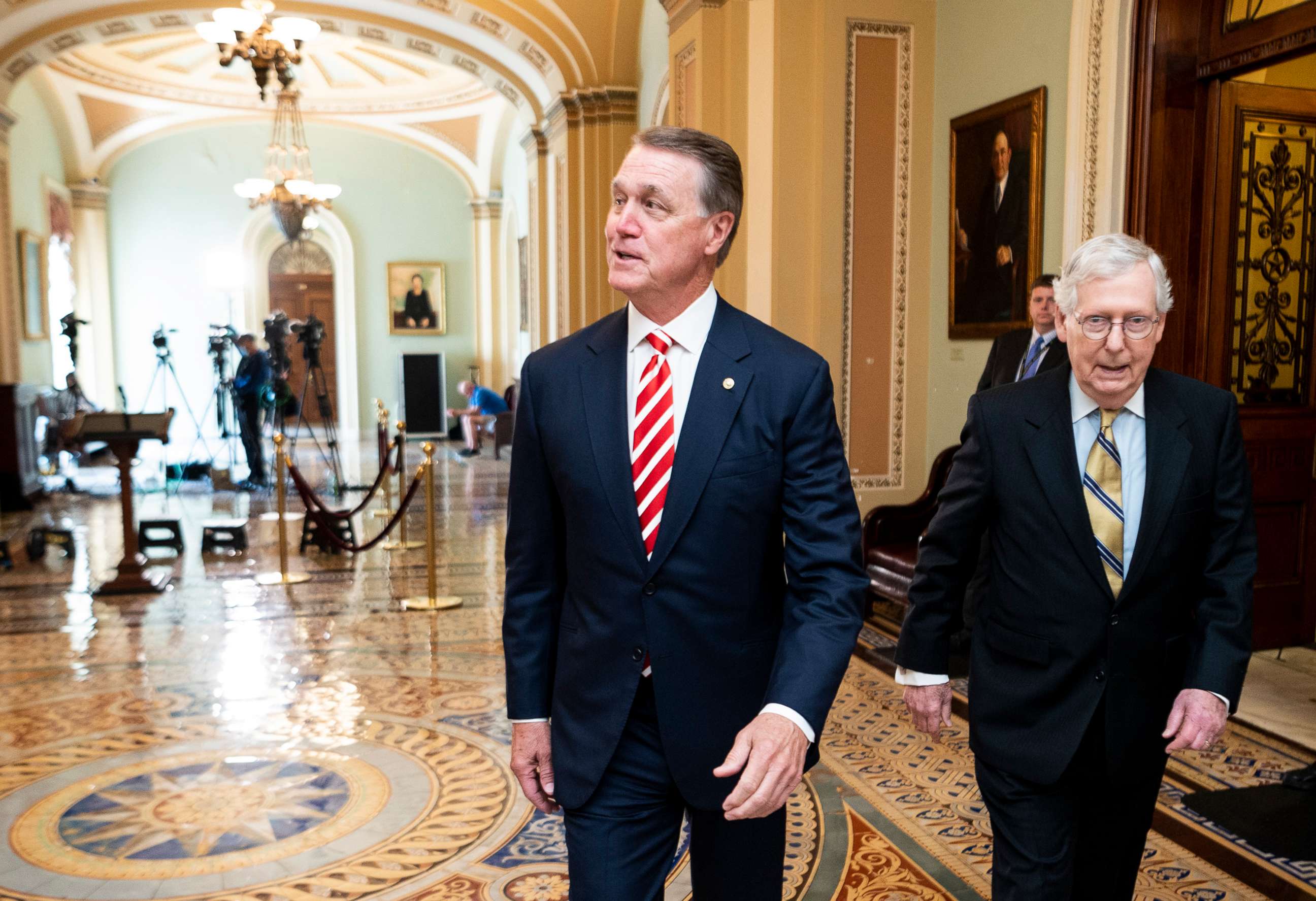 PHOTO: Former Sen. David Perdue walks through the Ohio Clock Corridor in the Capitol, July 20, 2021. 