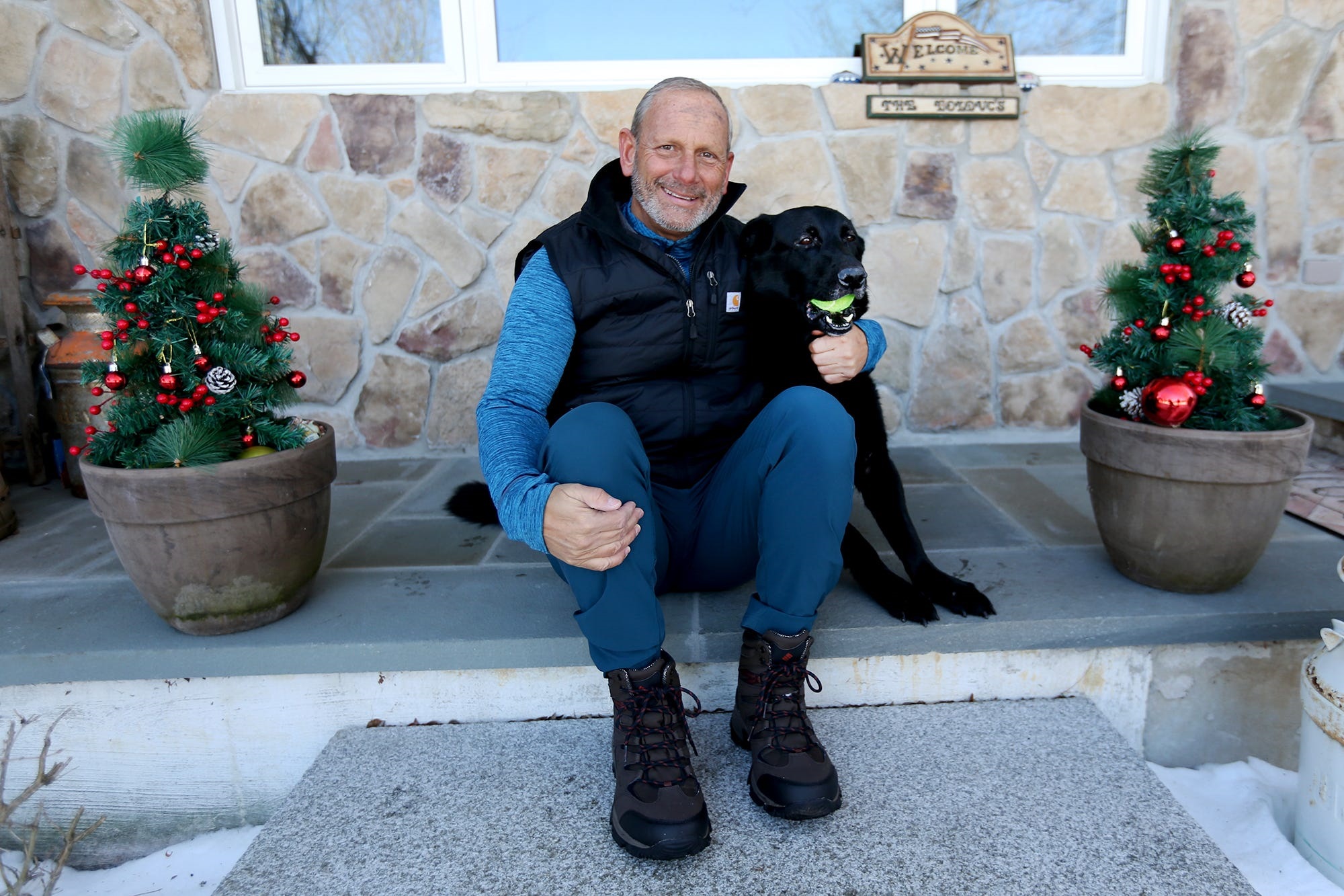 PHOTO: Retired Army Gen. Don Bolduc poses with his service dog in Portsmouth, N.H., Feb. 19, 2021.
