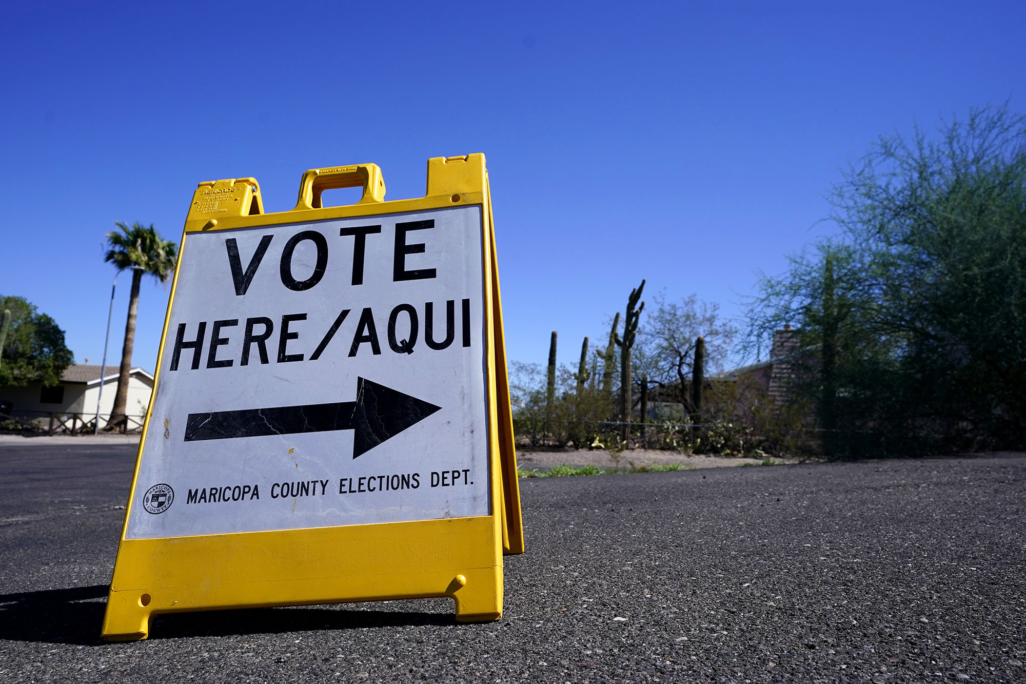 PHOTO: A sign marks the entrance to a voting precinct on the first day of early voting in the general election in Phoenix, Oct. 12, 2022.