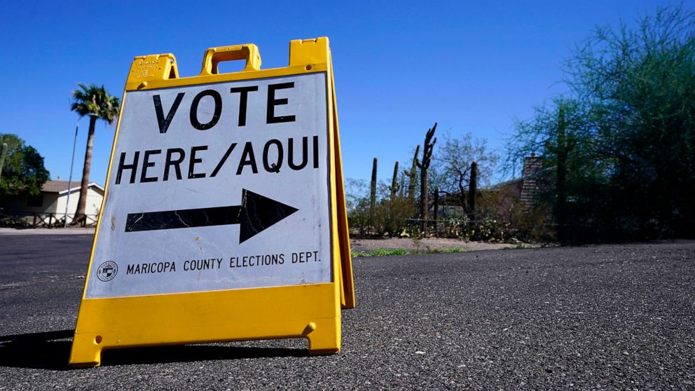 PHOTO: A sign marks the entrance to a voting precinct on the first day of early voting in the general election in Phoenix, Oct. 12, 2022.