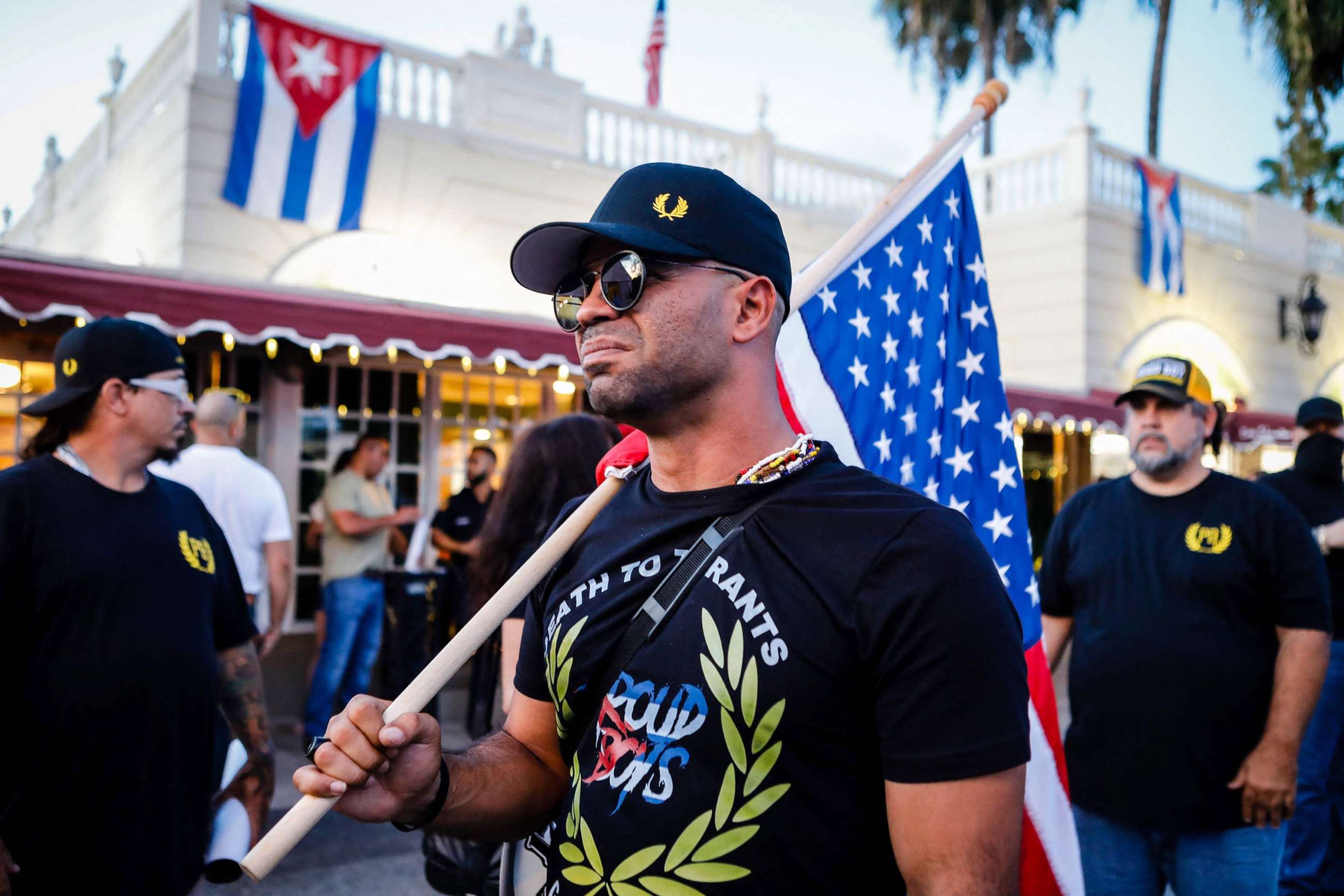 PHOTO: Henry "Enrique" Tarrio, leader of The Proud Boys, holds an American flag during a protest in Miami, July 16, 2021.