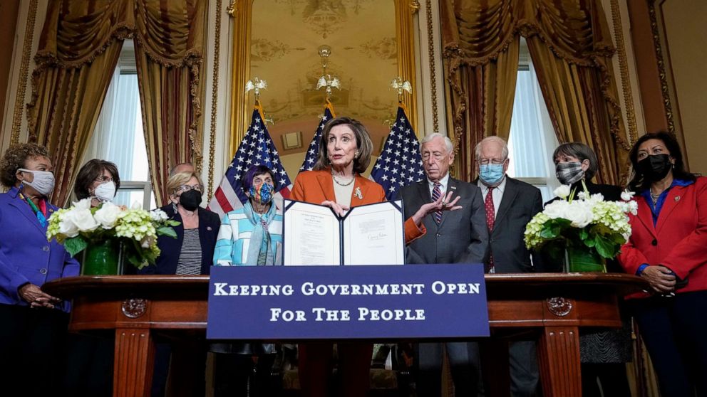 PHOTO: Surrounded by fellow House Democrats, Speaker of the House Nancy Pelosi speaks during a bill enrollment ceremony at the U.S. Capitol on Dec. 3, 2021.