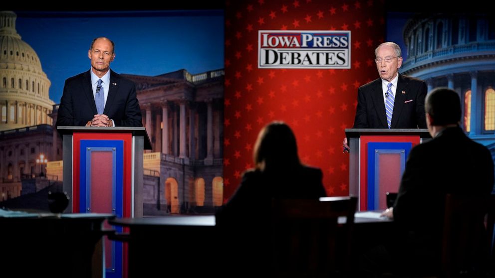 PHOTO: Iowa Democratic U.S. Senate candidate Mike Franken,and U.S. Sen. Chuck Grassley listen to a question during their debate, Oct. 6, 2022, in Des Moines, Iowa.