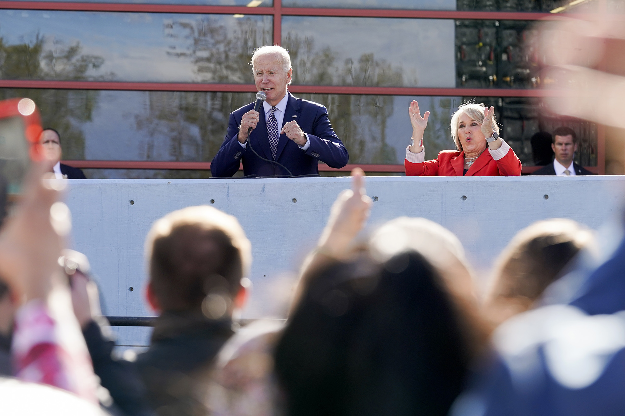 PHOTO: New Mexico Gov. Michelle Lujan Grisham, right, reacts as President Joe Biden speaks to an overflow crowd before a campaign rally Thursday, Nov. 3, 2022, in Albuquerque, N.M. 