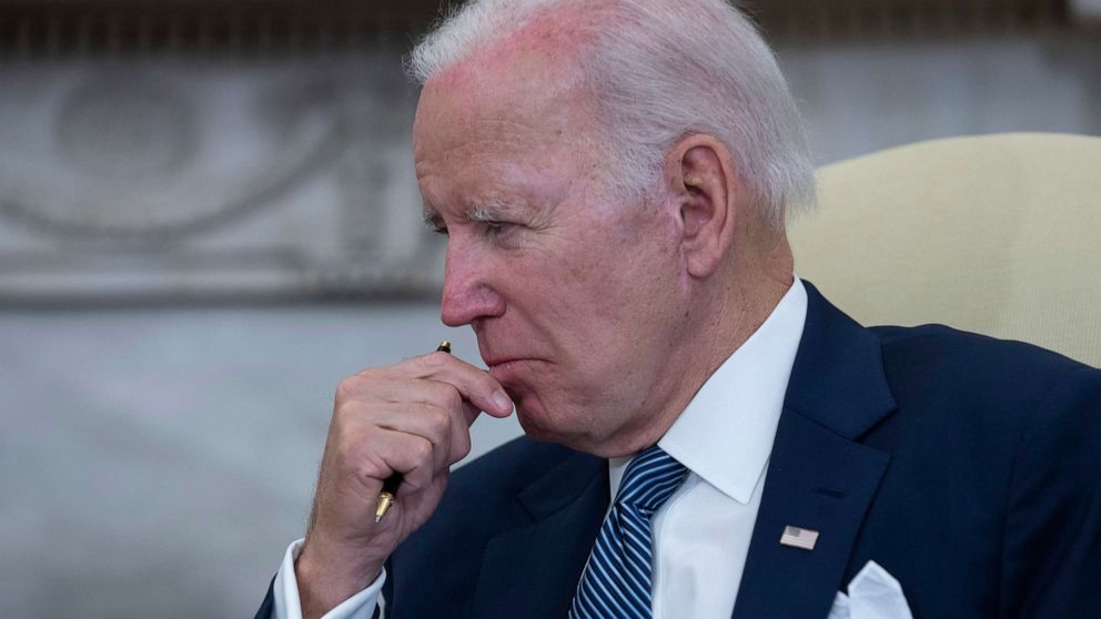 PHOTO: President Joe Biden listens during a meeting with reporters in the Oval Office of the White House, July 12, 2022.