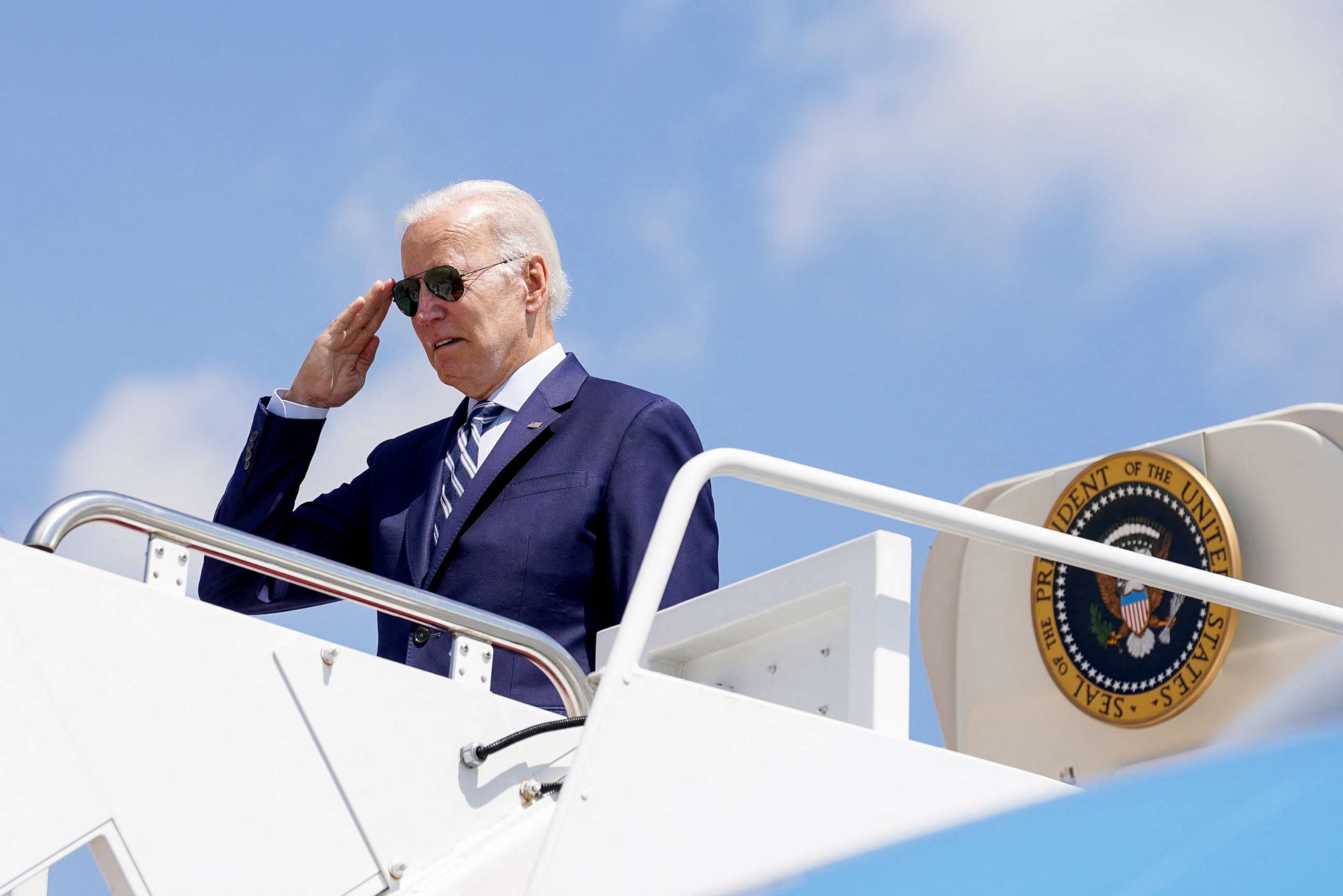 PHOTO: President Joe Biden salutes as he boards Air Force One to take off en route to Avoca, Pennsylvania, in Joint Base Andrews, Md., Aug. 30, 2022.