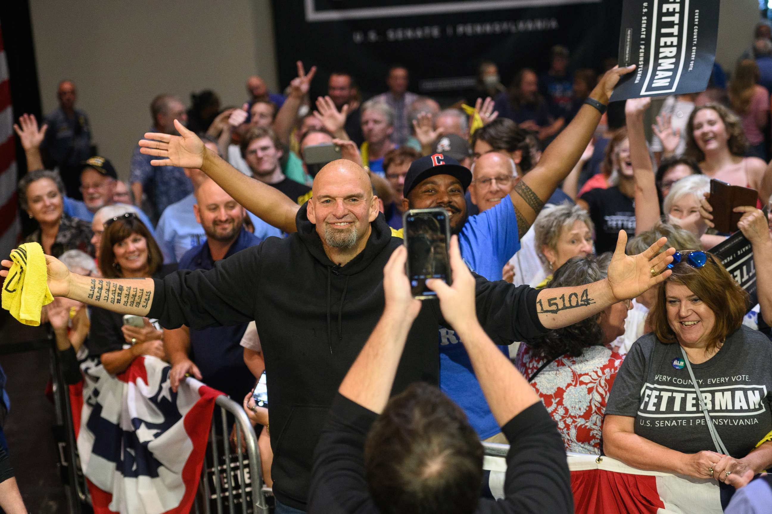 PHOTO: John Fetterman, lieutenant governor of Pennsylvania and Democratic senate candidate, takes a photo with attendees after a campaign rally in Erie, Pa., Aug. 12, 2022.