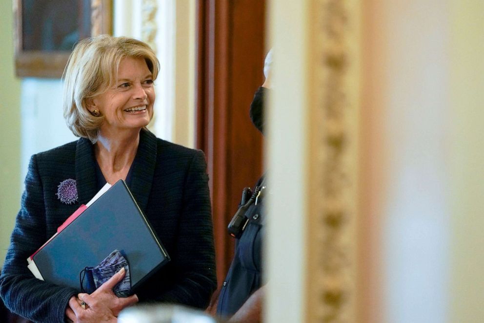 PHOTO: Senator Lisa Murkowski speaks with a security guard as she stands outside the Senate Chamber on Capitol Hill, Nov. 3, 2021.