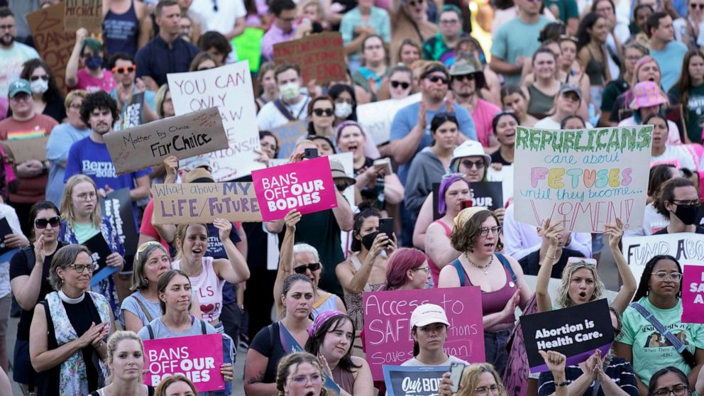 PHOTO: Abortion rights protesters attend a rally outside the state Capitol following the United States Supreme Court's decision to overturn Roe v. Wade in Lansing, Mich., June 24, 2022. 