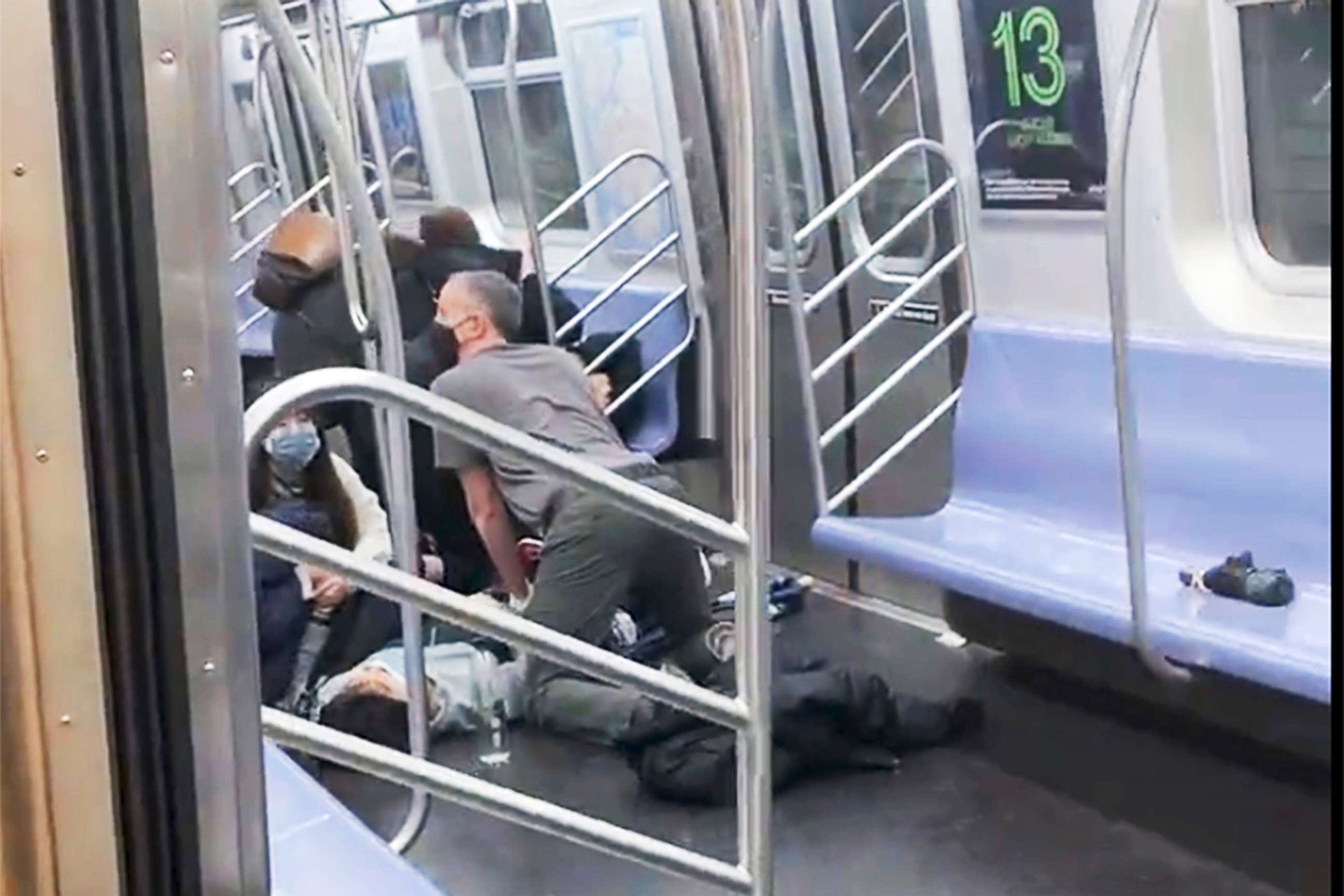 PHOTO: A person receives aid in the aftermath of a shooting in a subway car in the Brooklyn borough of New York, April 12, 2022.