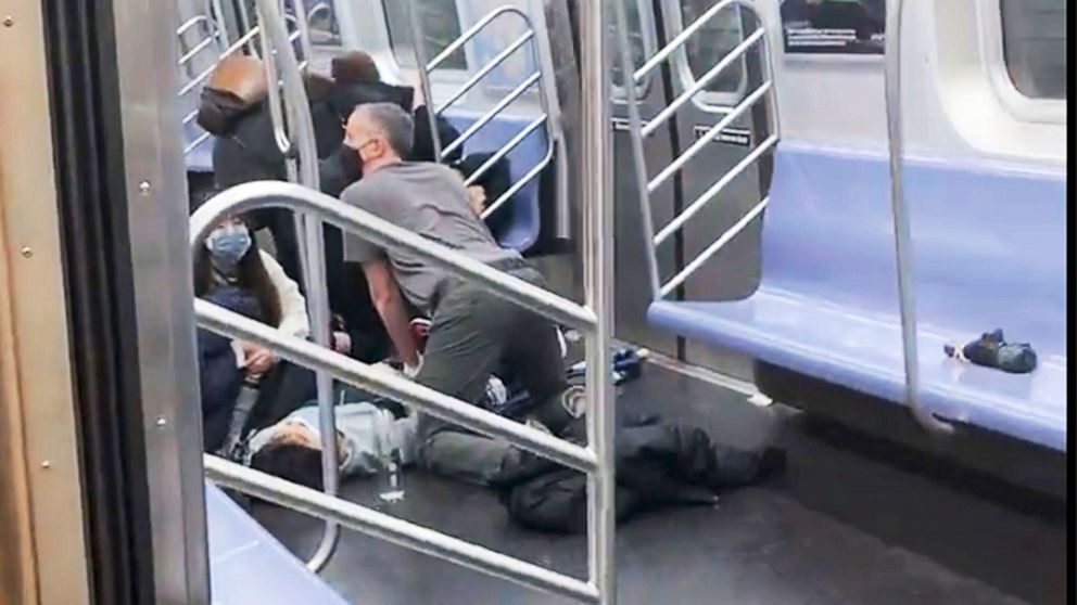 PHOTO: A person receives aid in the aftermath of a shooting in a subway car in the Brooklyn borough of New York, April 12, 2022.