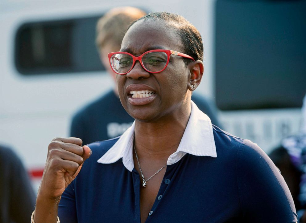PHOTO: Nina Turner speaking with supporters near the Cuyahoga County Board of Elections before casting her vote in Cleveland, July 7, 2021. 