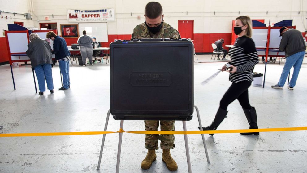 PHOTO: Mst. Sgt. Sam Wallace fills out a ballot at the St. Paul's National Guard Armory on Election Day in in St. Pauls, N.C., Nov. 3, 2020.