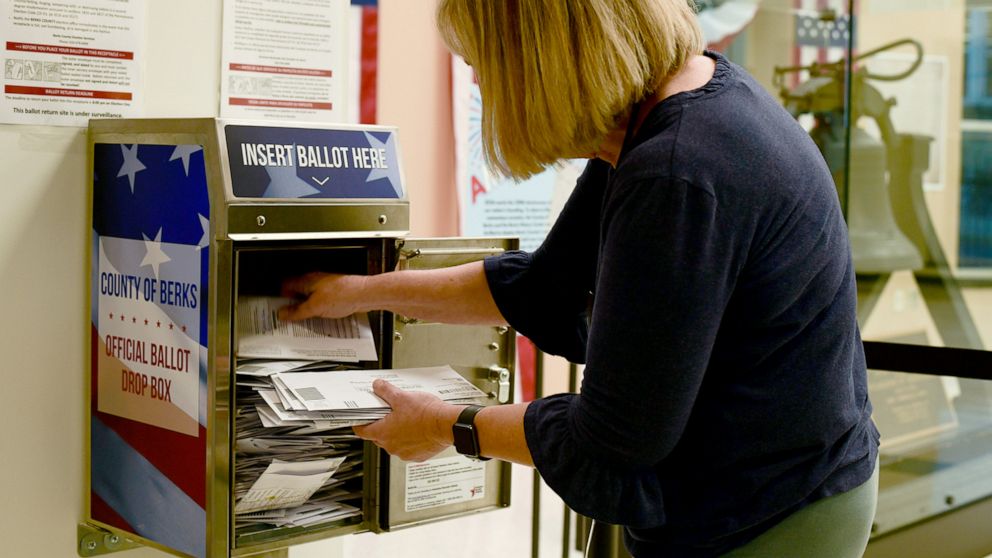 PHOTO: An election official removes mail-in ballots from a full drop box in the town of Reading, in Berks County Pa. Nov. 7, 2022.