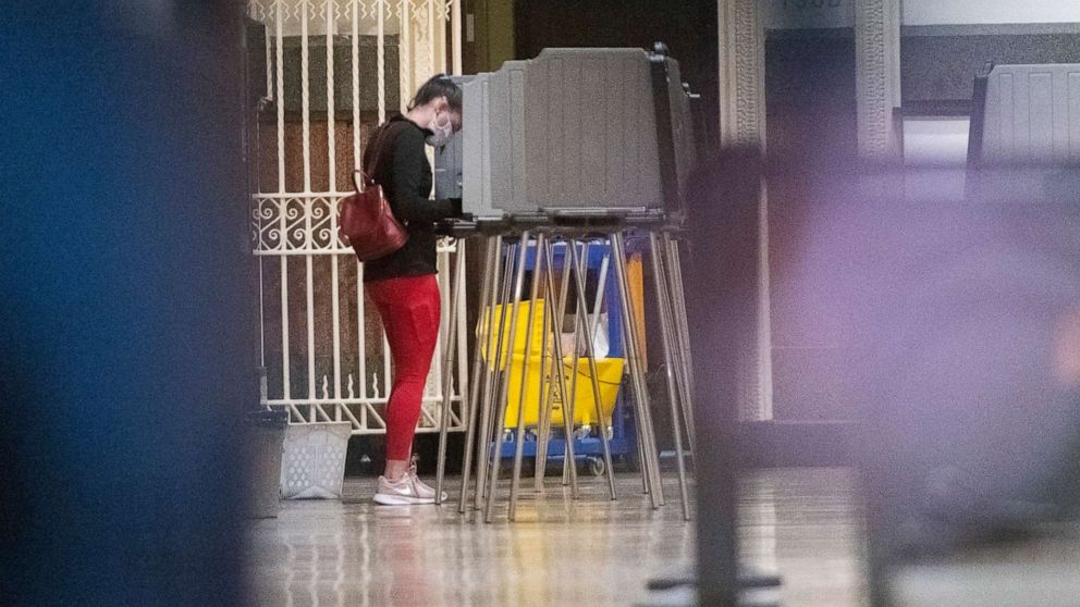 PHOTO: A woman casts her ballot at Philadelphia City Hall on the final day to vote early at a satellite polling station in Philadelphia, Oct. 27, 2020.
