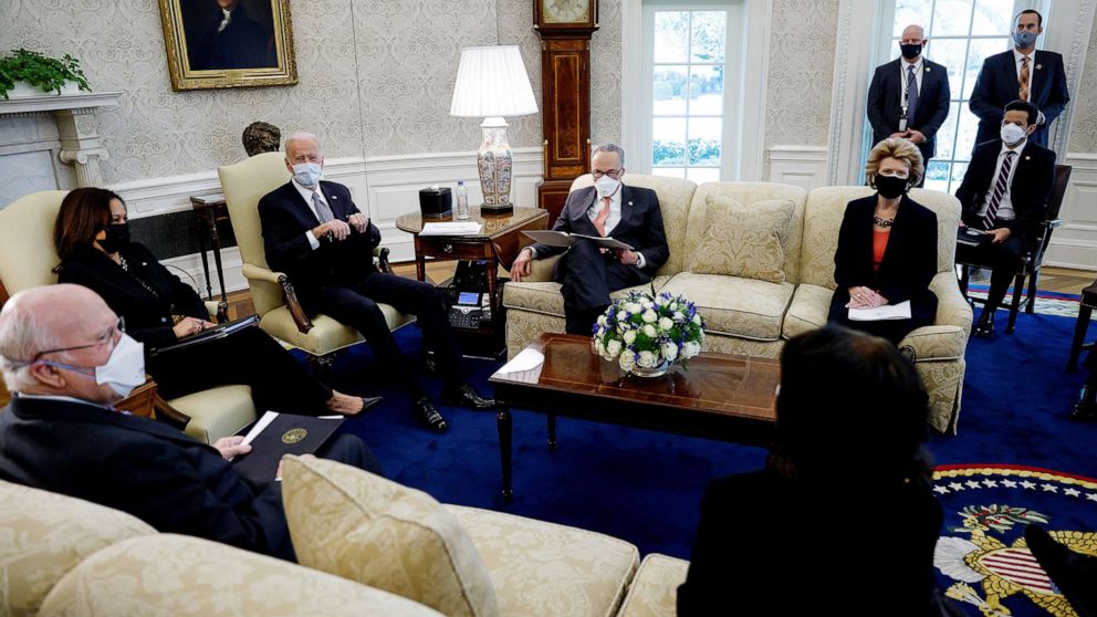 PHOTO: President Joe Biden and Vice President Kamala Harris discuss coronavirus aid legislation with Democratic senators during a meeting in the Oval Office at the White House, Feb. 3, 2021. 