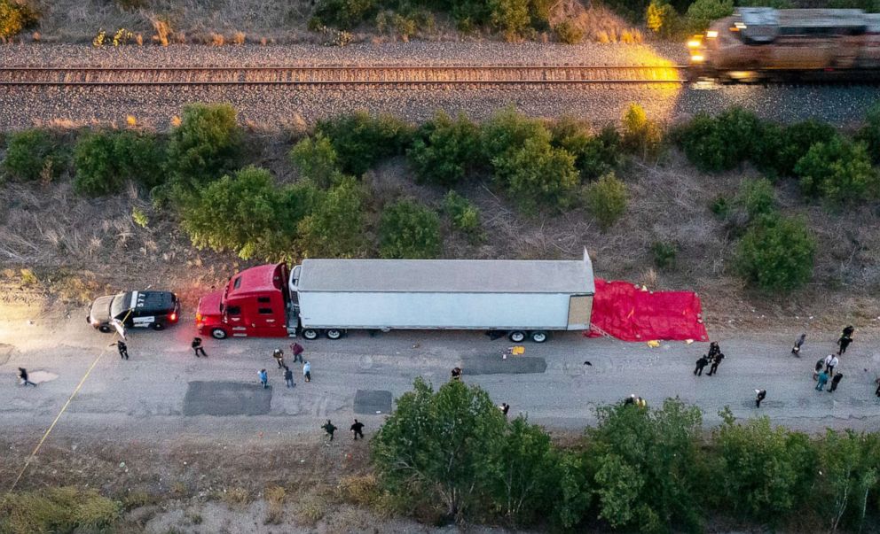 PHOTO: Members of law enforcement investigate the scene of the discovery of at least 46 people, believed to be migrant workers from Mexico, who were found dead in an abandoned tractor trailer in San Antonio, Texas, June 27, 2022.