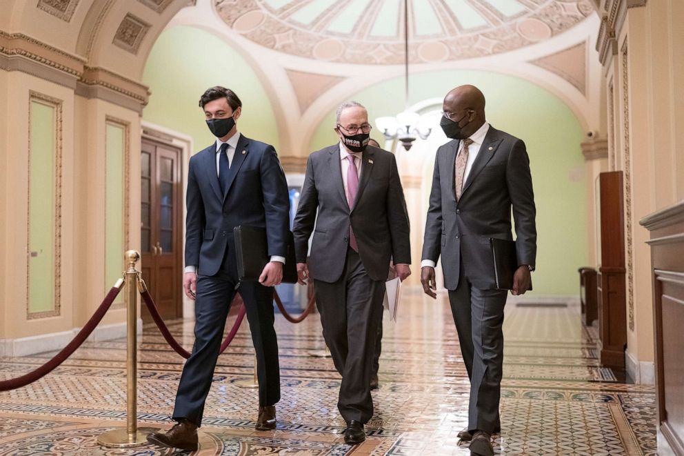 PHOTO: Senate Majority Leader Chuck Schumer is joined by Sen. Jon Ossoff and Sen. Raphael Warnock for a news conference to discuss the COVID relief bill, at the Capitol in Washington, Feb. 11, 2021. 