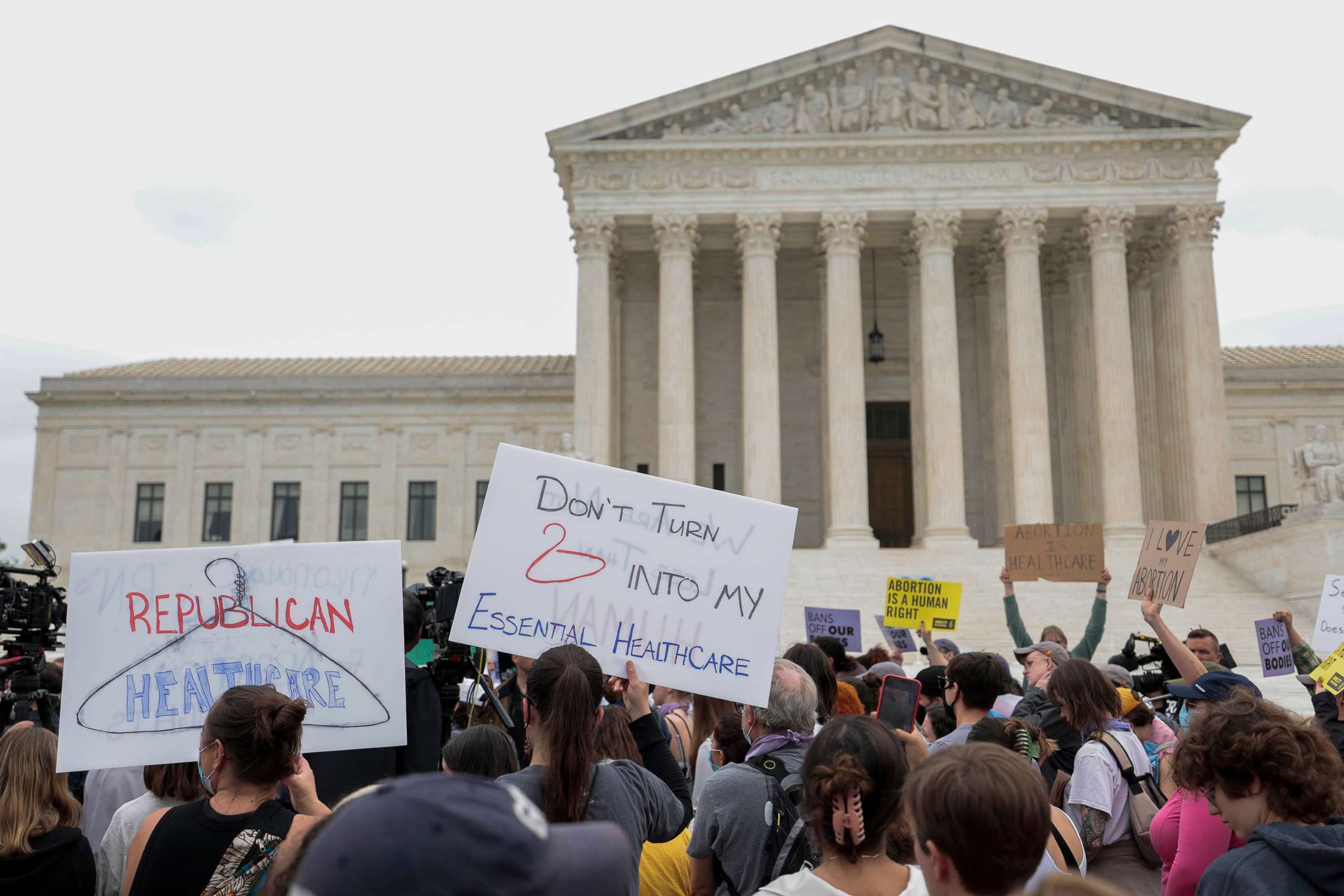 PHOTO: Activists demonstrate in front of the U.S. Supreme Court Building in response to the leaked Supreme Court draft decision to overturn Roe v. Wade in Washington,  May 03, 2022.