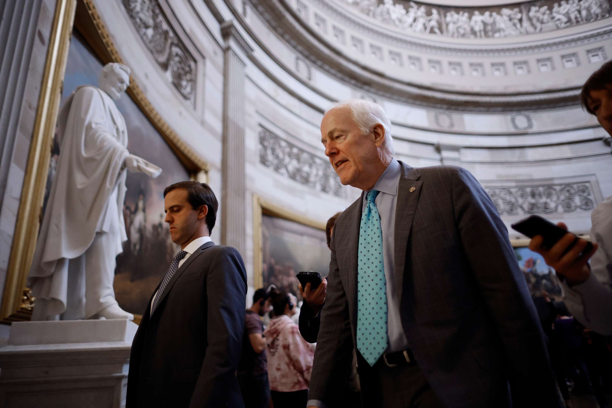 PHOTO: Following a speech on the Senate floor in support of the Bipartisan Safer Communities Act, Senate Minority Whip John Cornyn talks to reporters as he walks through the U.S. Capitol Rotunda in Washington, June 23, 2022.