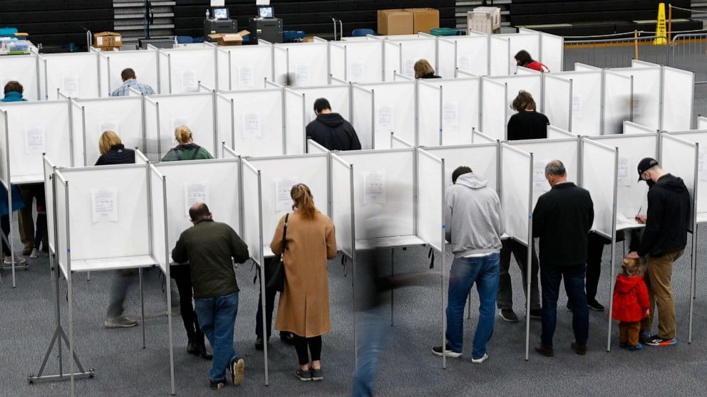 PHOTO: Voters fill out their ballots at voting booths in Scarborough, Maine, November 2, 2021.