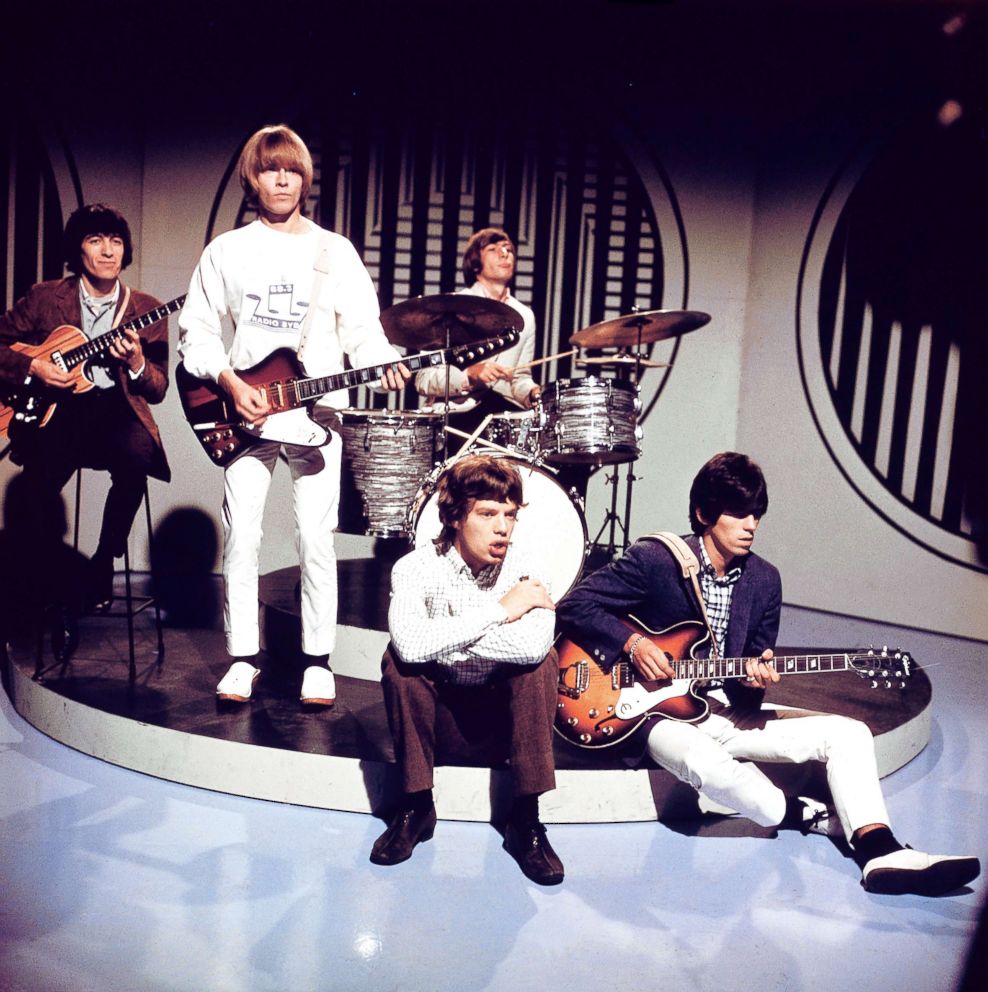 PHOTO: From Left members of The Rolling Stones Bill Wyman, Brian Jones, Mick Jagger, Charlie Watts (behind), Keith Richards (playing Epiphone guitar), pose on the set of a TV Show in this undated photo.