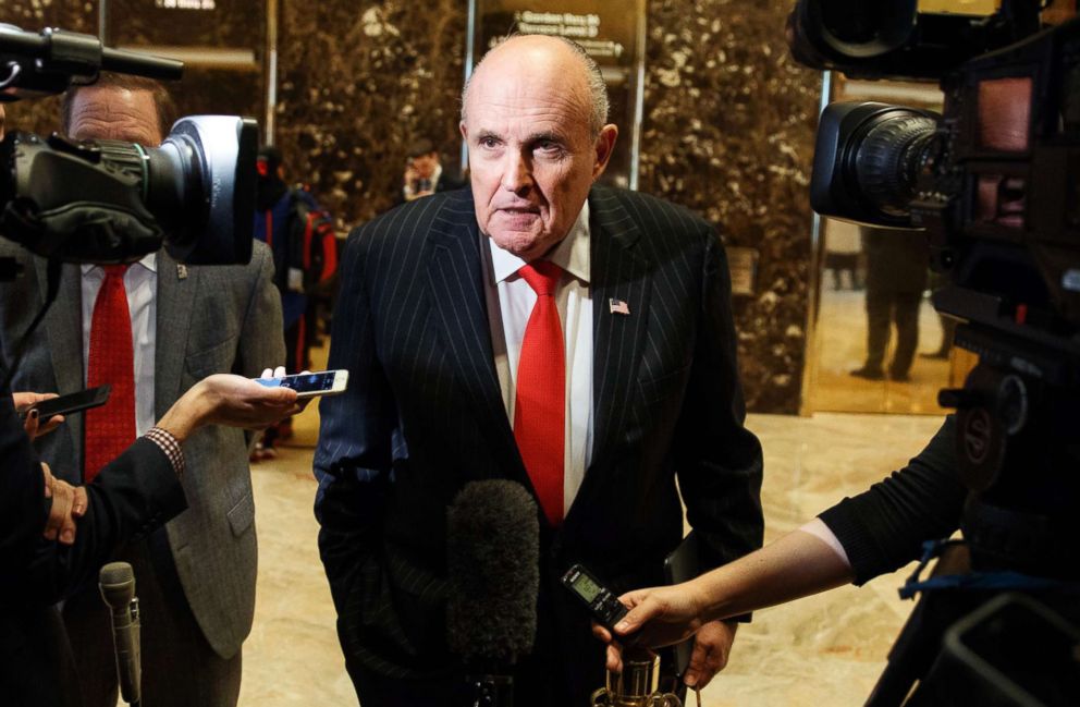 PHOTO: Former New York City Mayor Rudy Giuliani talks with reporters in the lobby of Trump Tower in New York, Jan. 12, 2017. Giuliani has become the face of President Donald Trump's aggressive new legal team.