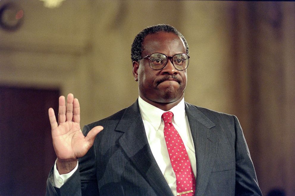 PHOTO: Supreme Court nominee Clarence Thomas raises his right hand as he is sworn in, Sept. 10, 1991, during confirmation hearings before the US Senate Judiciary Committee, in Washington D.C.