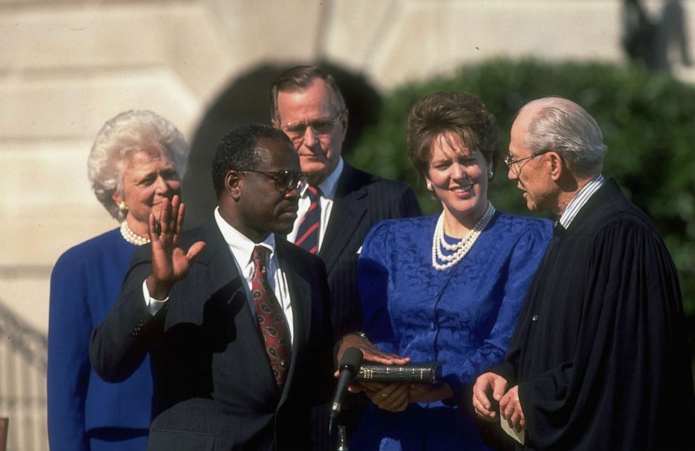 PHOTO: Supreme Court Justice Byron White swears in new Justice Clarence Thomas, with  his wife Virginia Thomas and President George H.W. Bush and First Lady Barbara Bush, outside of the White House, Oct. 18, 1991.