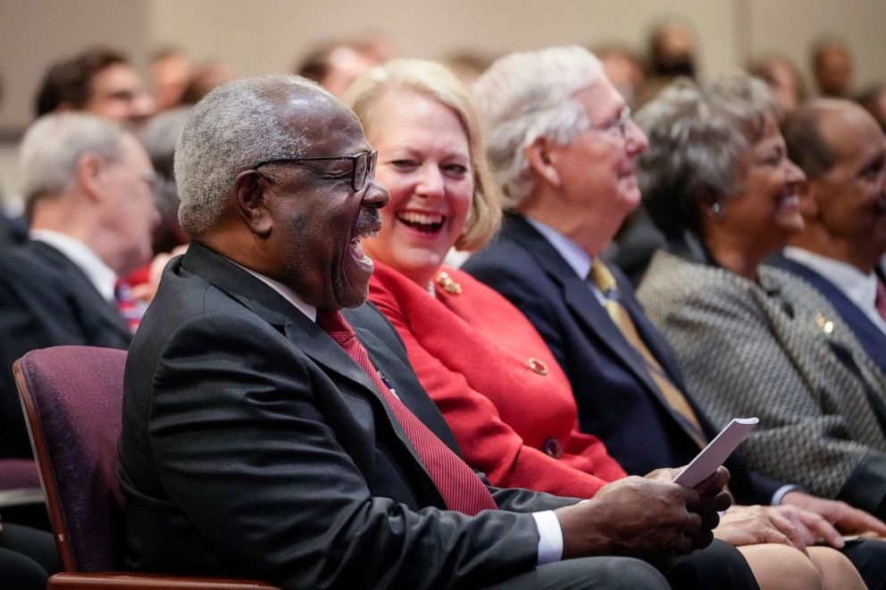 PHOTO: Supreme Court Justice Clarence Thomas sits with his wife Virginia Thomas while he waits to speak at the Heritage Foundation, Oct, 21, 2021, in Washington, D.C.