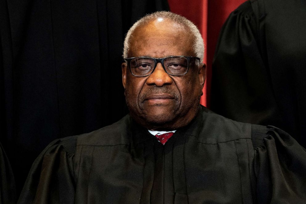 PHOTO: Associate Justice Clarence Thomas poses during a group photo of the Justices at the Supreme Court, April 23, 2021.