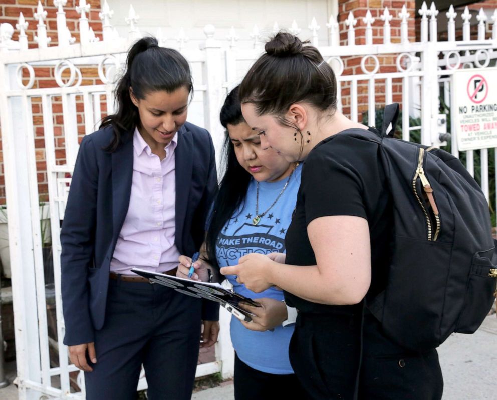 PHOTO: Tiffany Caban consults her campaign team while canvassing for votes in Queens, New York, June 21, 2019.