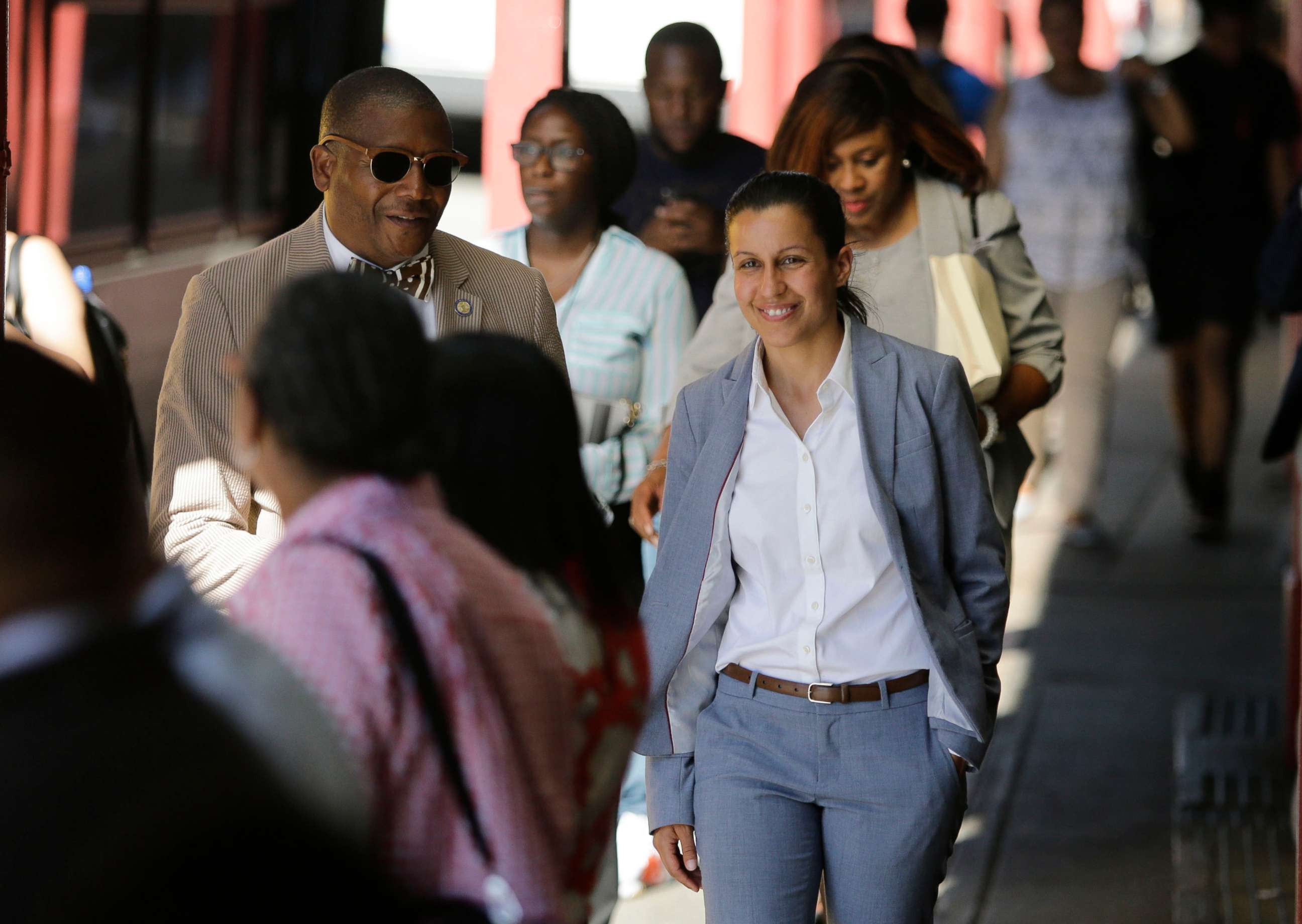 PHOTO: Queens district attorney candidate Tiffany Caban walks among commuters Wednesday, June 26, 2019, in the Queens borough of New York