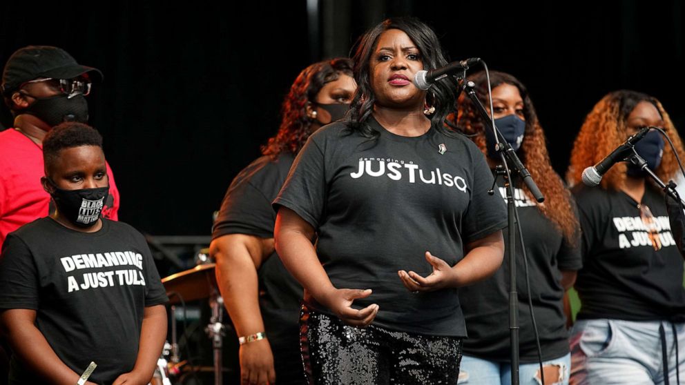 PHOTO: In this June 19, 2020, file photo, Dr. Tiffany Crutcher is seen on stage with family members during events to mark Juneteenth, in Tulsa, Oklahoma.