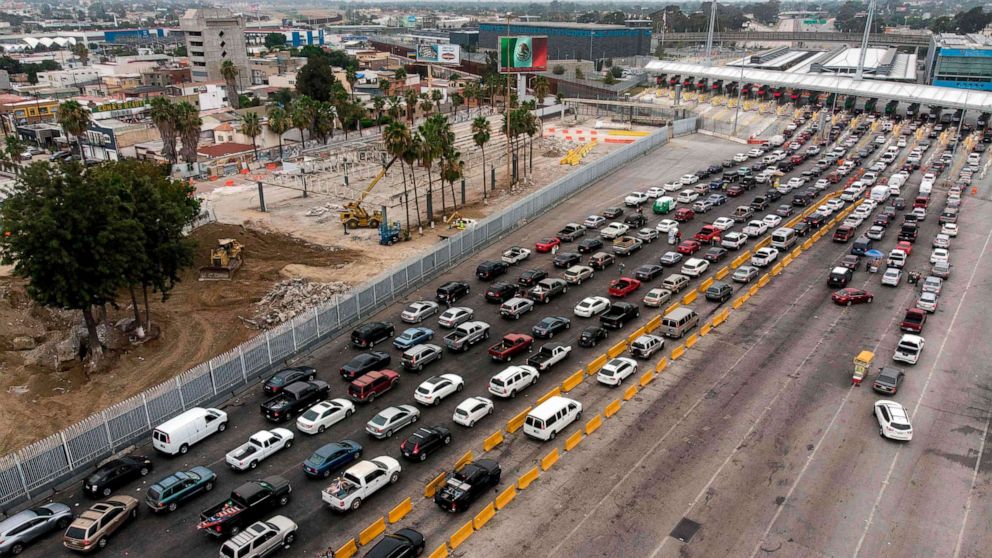 PHOTO: Aerial view of Mexico's old customs facilities (above), next to the construction site of an expansion of the crossing lanes at San Ysidro crossing port on the US-Mexico border in Tijuana, Baja California state, on July 27, 2020.