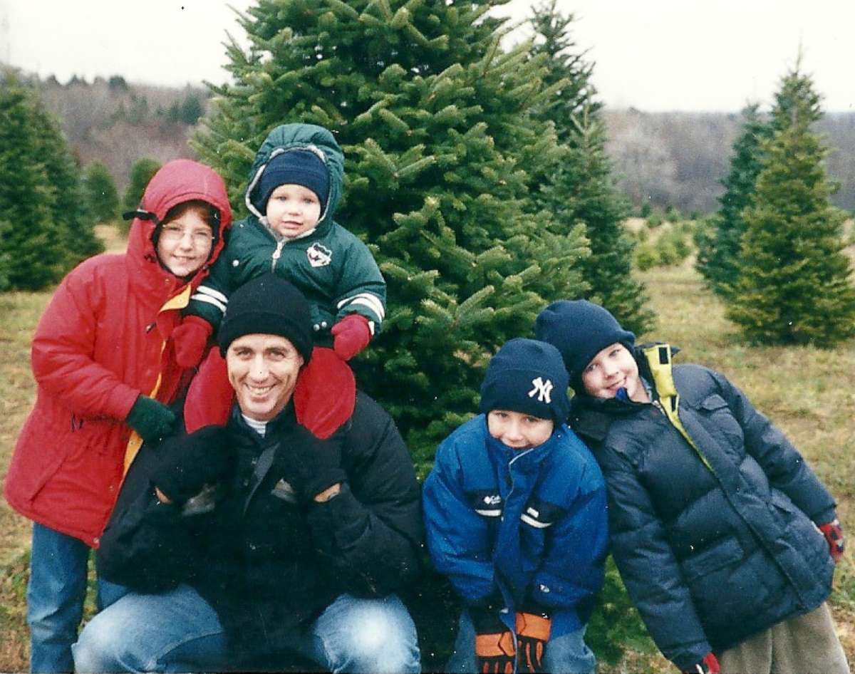 PHOTO: Former Lt. Col. Timothy Brooks poses with his four children before cutting down a Christmas tree at their home in Fort Drum, N.Y., in Nov. 2001.